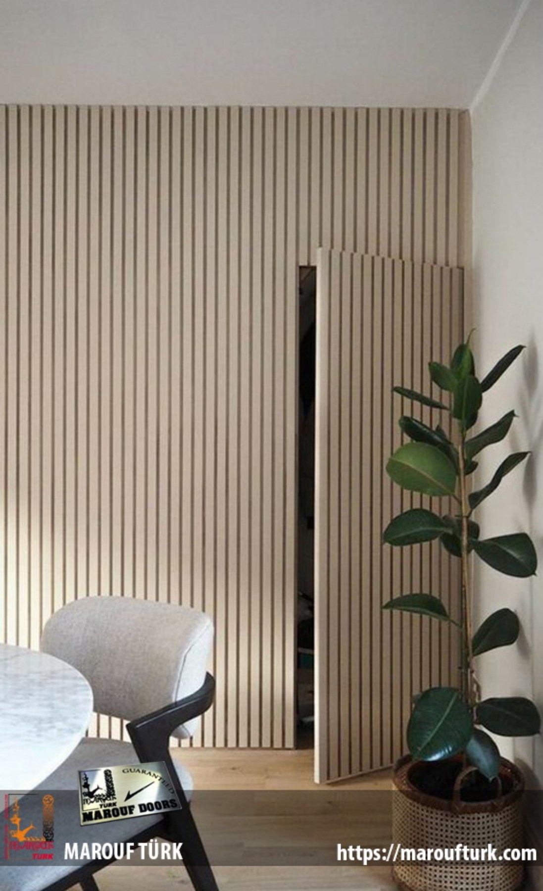 Concealed interior door coordinated with a vertical slatted wall