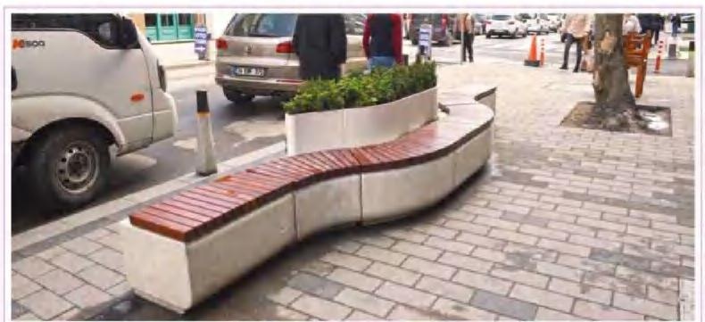 Istiklal curved modular bench with timber seating in a paved public space