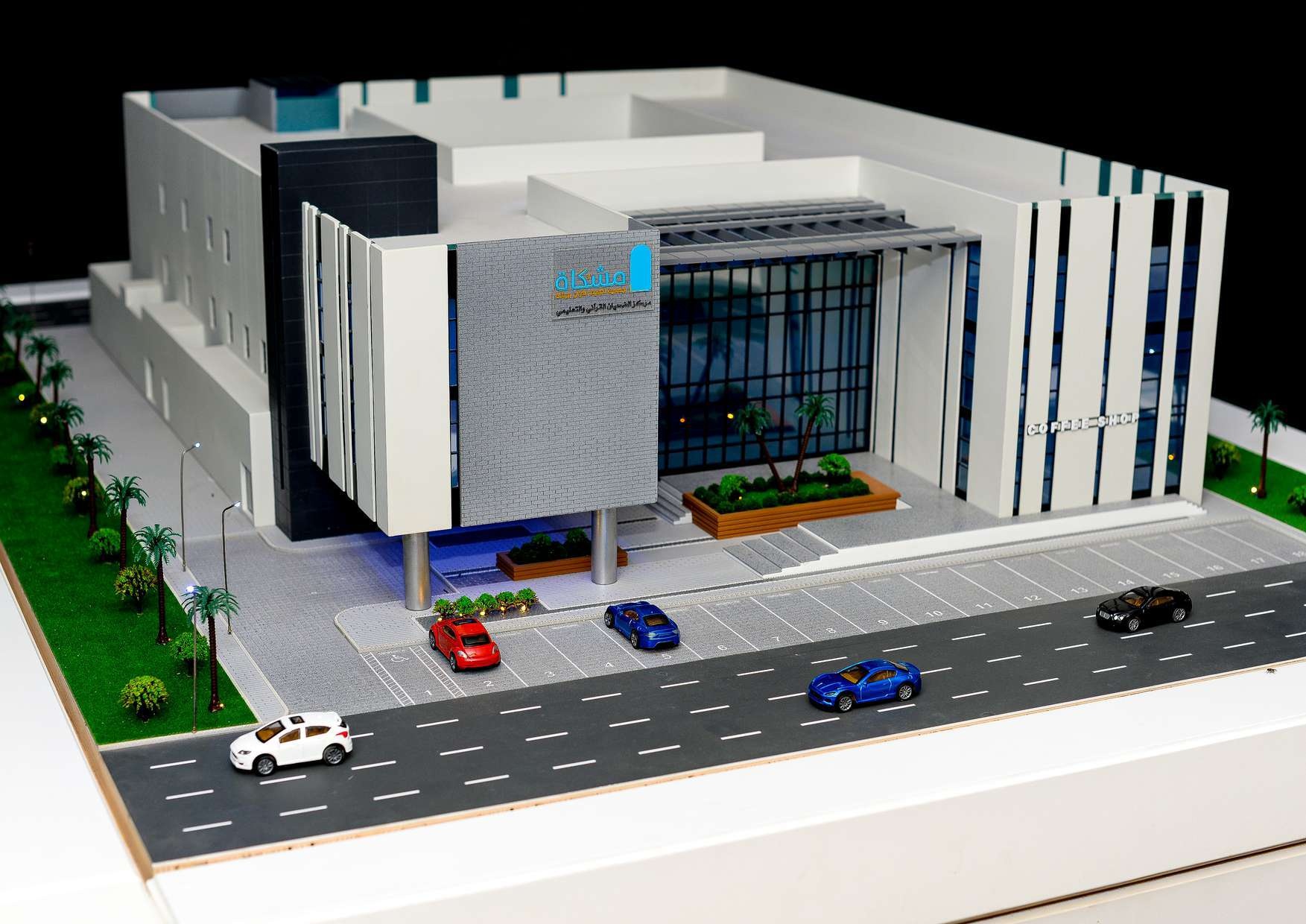 Scale model of a commercial building with roads and surrounding landscape