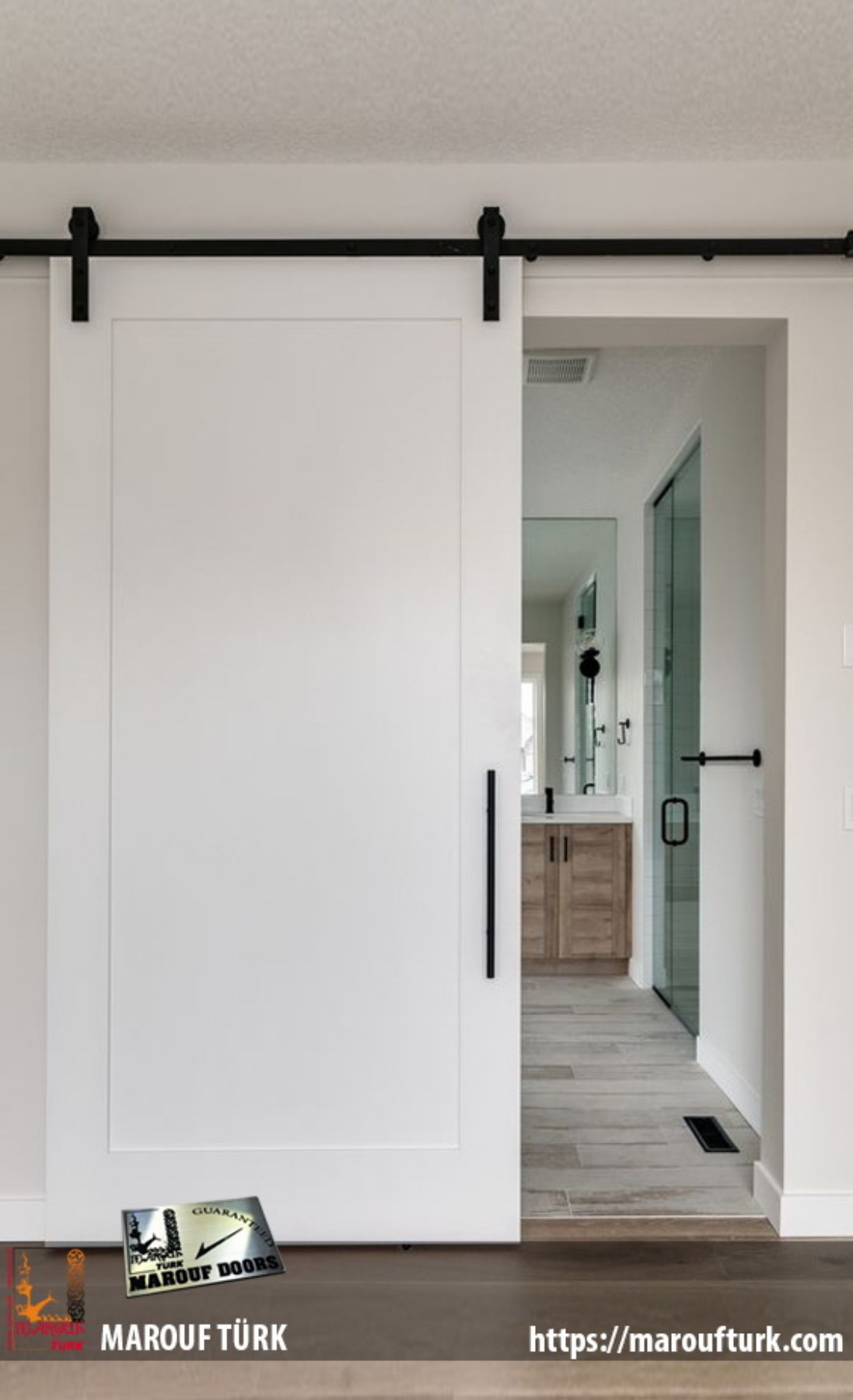 White sliding door with exposed black track in the wooden doors collection