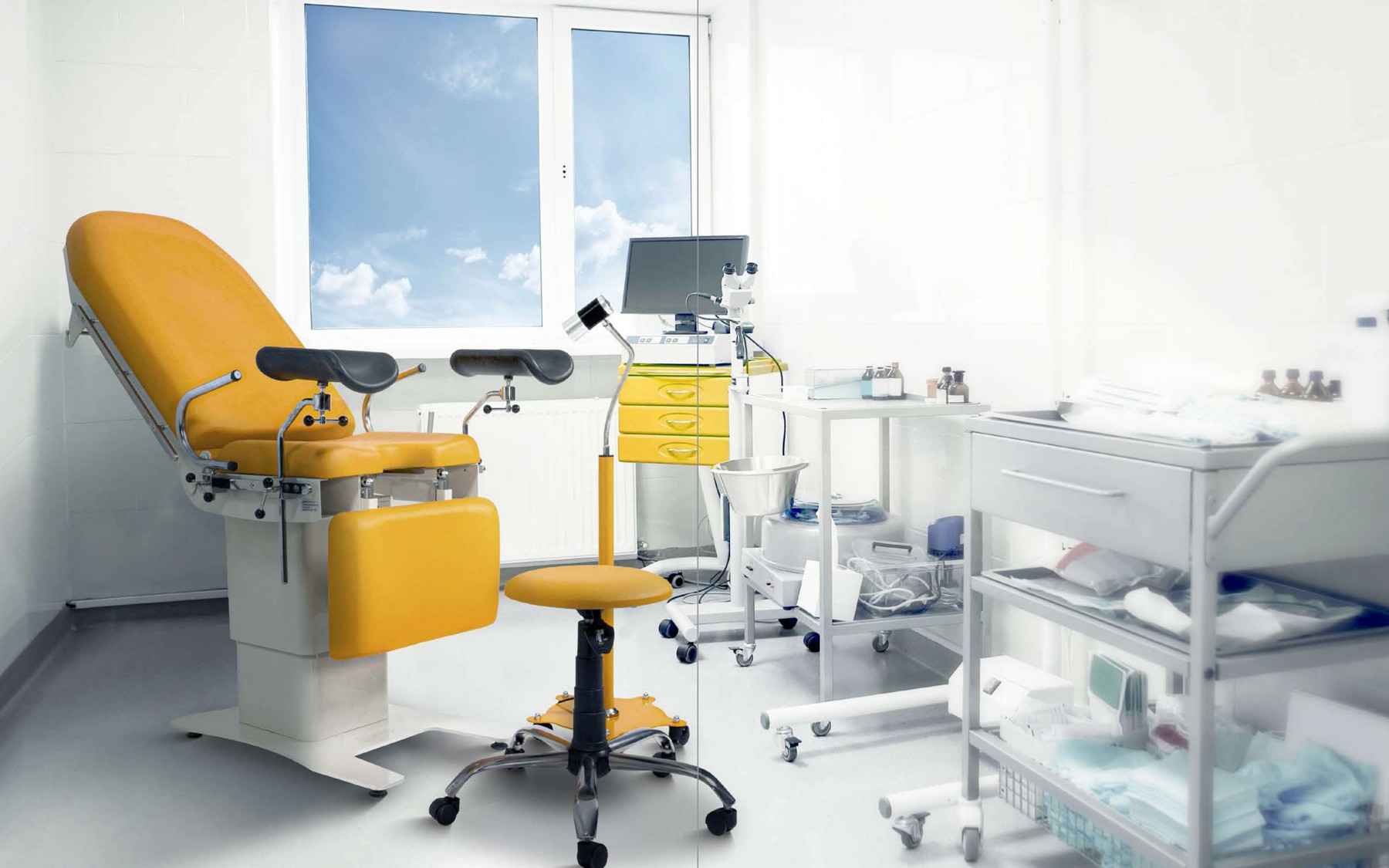 Gynaecological examination table with supports and matching stool