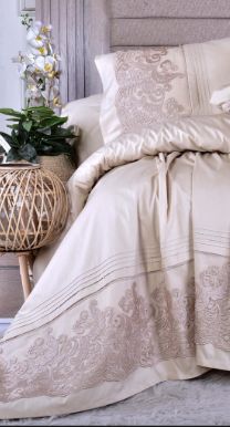 Cream embroidered bed set with decorative border by Jubair Tex
