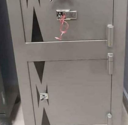 Black metal safe with front keypad and handle